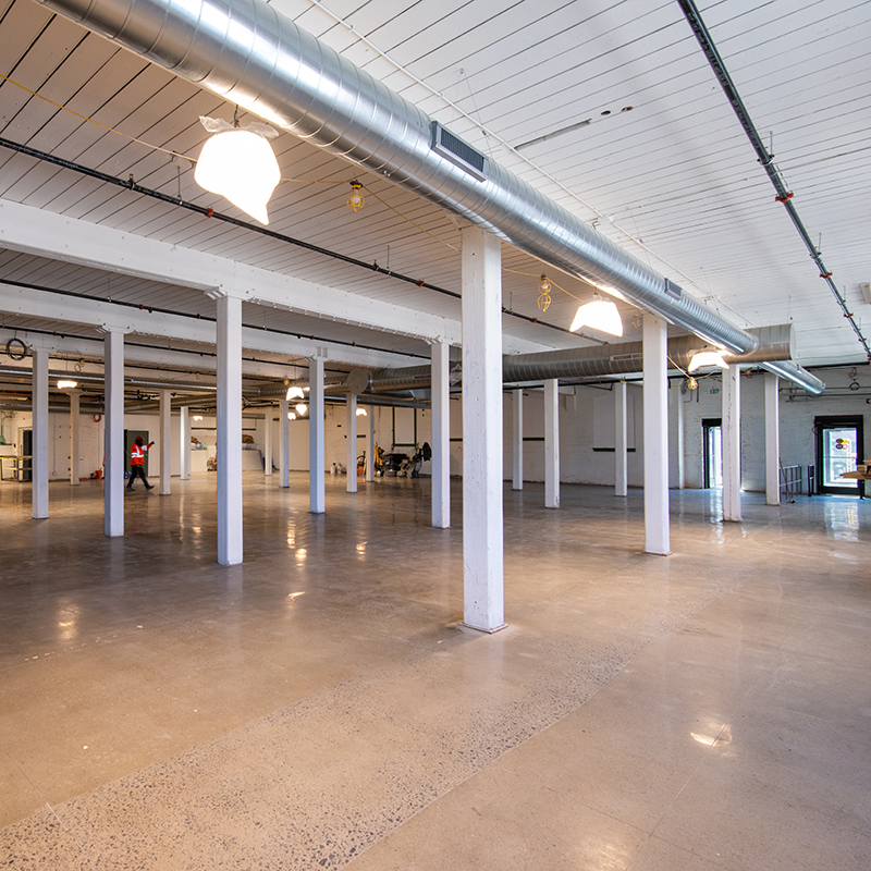 Interior view of 558 River Street; concrete floors, columns, white ceilings