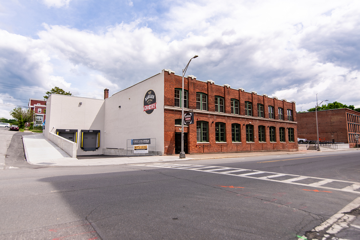 Exterior of Bargain Grocery with a new two-story loading dock.